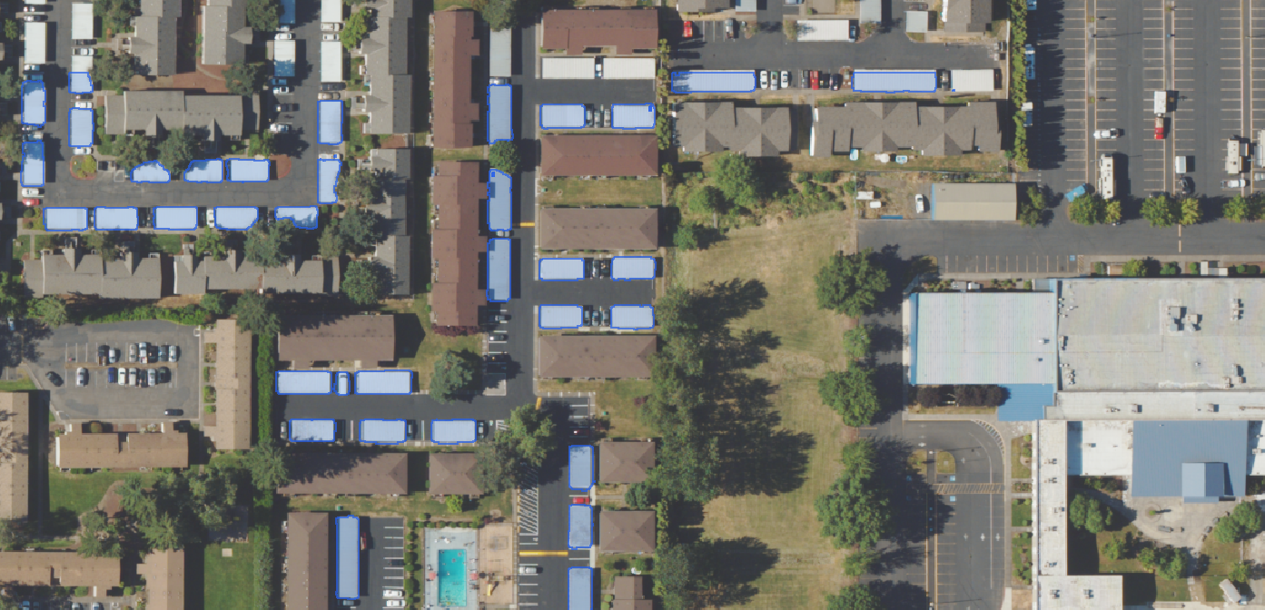 SAM 3 false positive shipping container detections on rectangular structures.