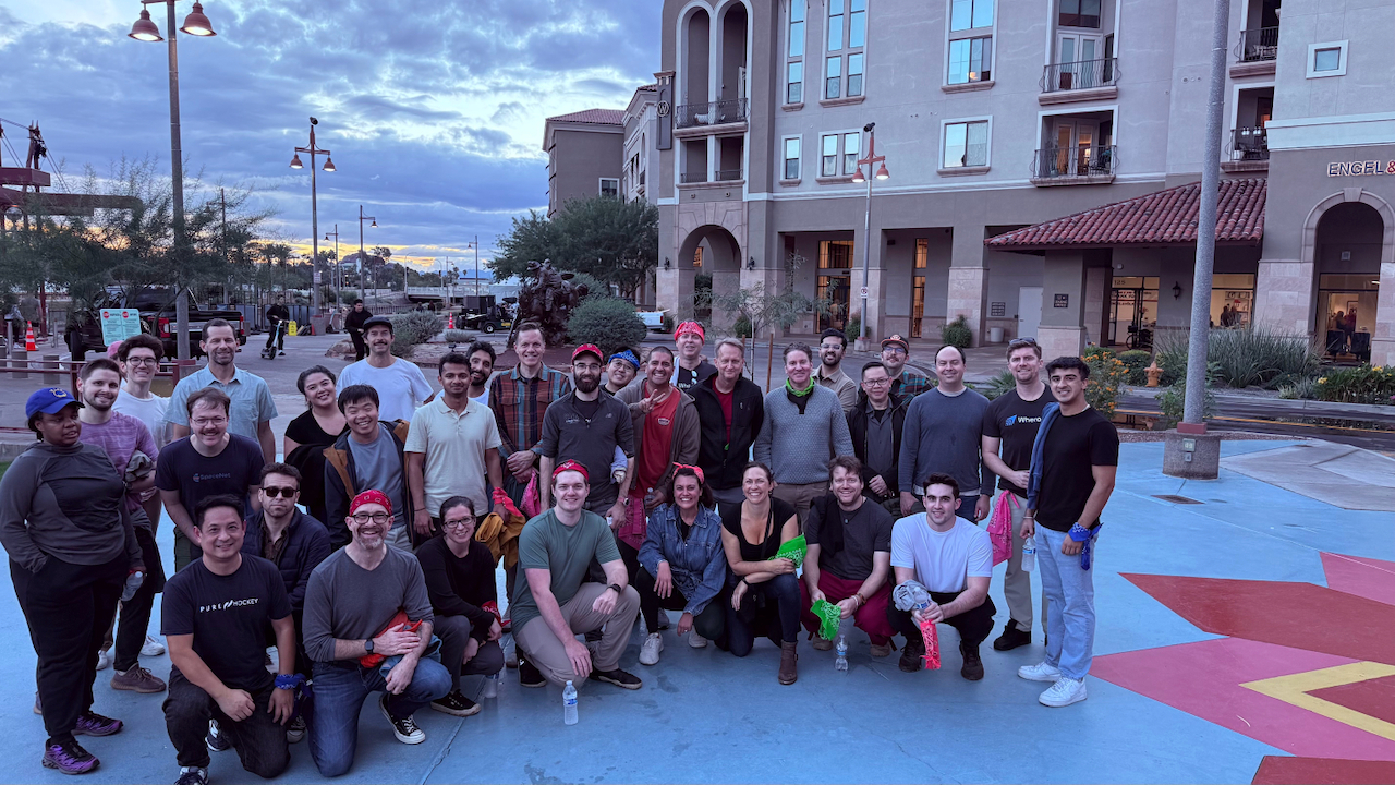 Wherobots teammates gathered in an outdoor plaza.