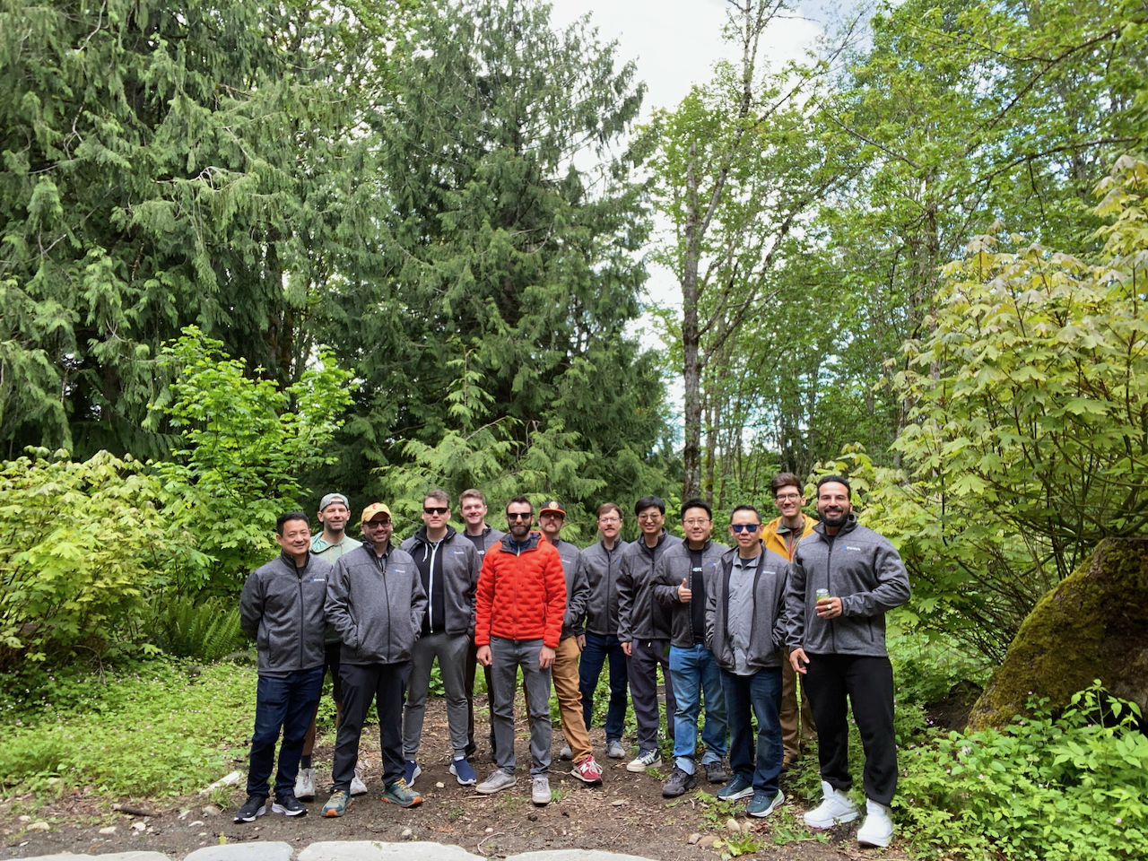 Wherobots teammates on a forest trail.