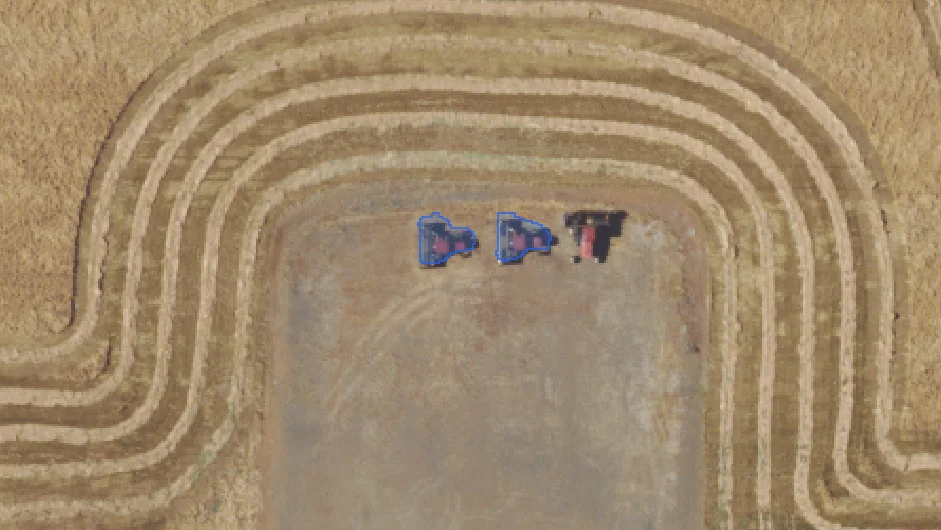 SAM 3 detecting tractors in a field.